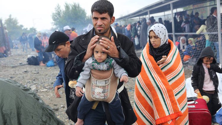 europe-refugee-crisis-father-and-baby-caritas-greece_opt_fullstory_large